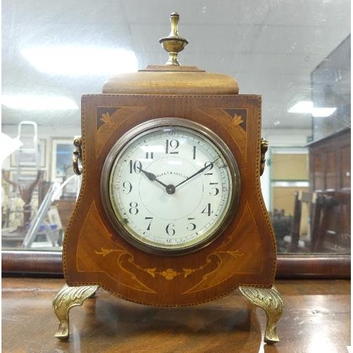 485 - An Edwardian inlaid mahogany Mantel Clock, by Walker & Hall Ltd with French movement, raised on bras... 