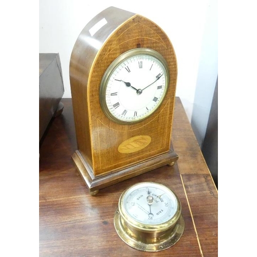 487 - An Edwardian inlaid mahogany Mantel Clock, with pointed arched top and shell cartouche raised on bun... 