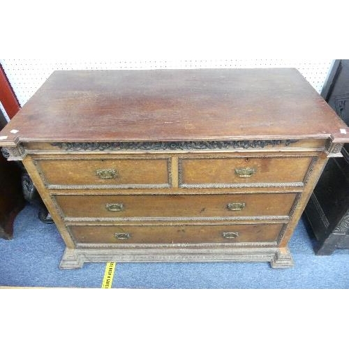 490 - A Continental antique carved oak Chest of Drawers, with two short drawers above two long, brass hand... 