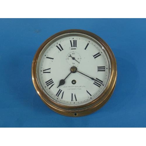 505 - A brass Bulkhead Clock, signed 'Lilley & Reynolds Ltd., London E.C.3', the 6in (15.25cm) diameter wh... 