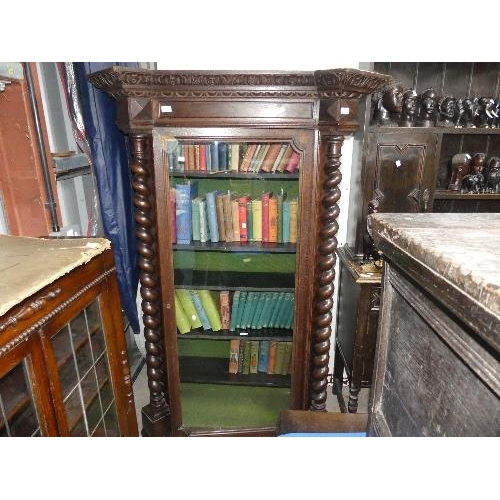 70 - A Victorian oak glazed Bookcase, with central glazed door and fitted shelves, flanked by barley-twis... 