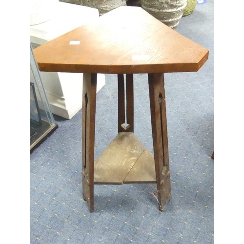 111 - An Arts and Crafts oak three legged table, height 27in x depth 16in x width 16in (68cm x 40cm x 40cm... 