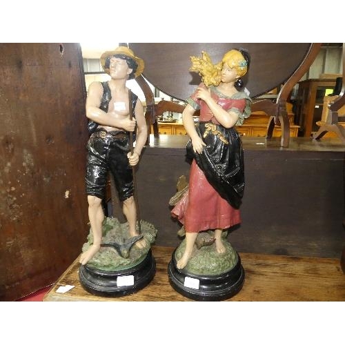 122 - A pair of early 20thC painted large spelter figures, depicting a man and a woman working the land, o... 