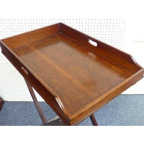 448 - A 19thC mahogany Butler's Tray, with kidney shaped apertures, on a folding stand, width 29in x depth... 