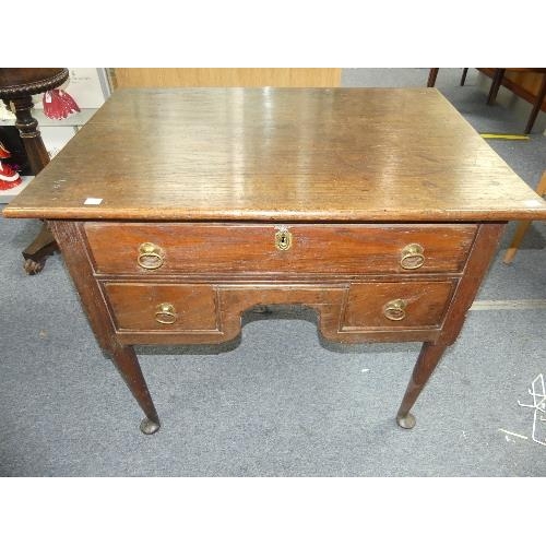 455 - A George III oak Lowboy, one long drawer above two short, the plain supports with pad feet, 34½in (8... 