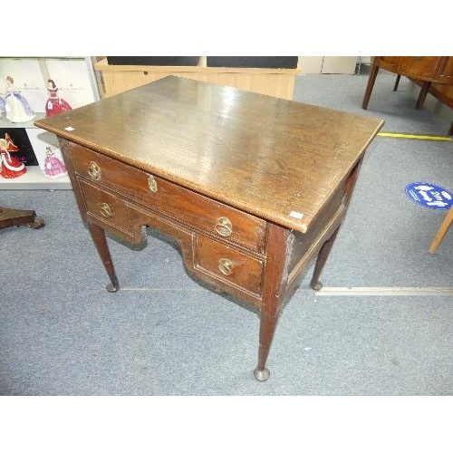 455 - A George III oak Lowboy, one long drawer above two short, the plain supports with pad feet, 34½in (8... 