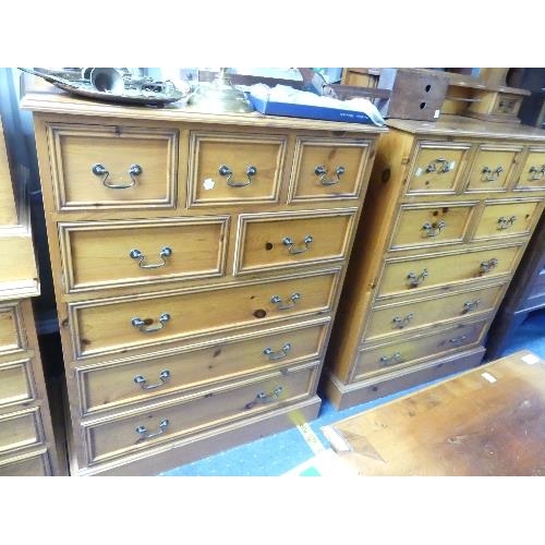 47 - A modern good quality pine bedroom Suite, comprising a pair of bedside chests of drawers, a kneehole... 