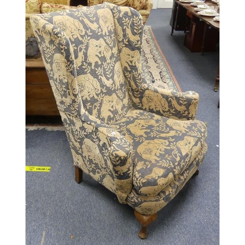 471 - A Wing Armchair, with blue / sand coloured 'elephant' upholstery, 43in (109cm) high x 34in (86.5cm) ... 