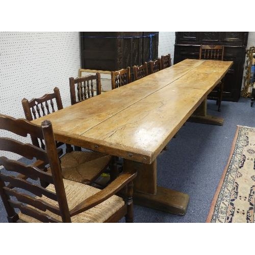 477 - A large Refectory Dining Table, the two-plank top with cleated ends, the base on supports and sledge... 