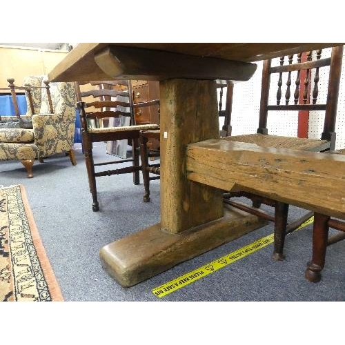 477 - A large Refectory Dining Table, the two-plank top with cleated ends, the base on supports and sledge... 