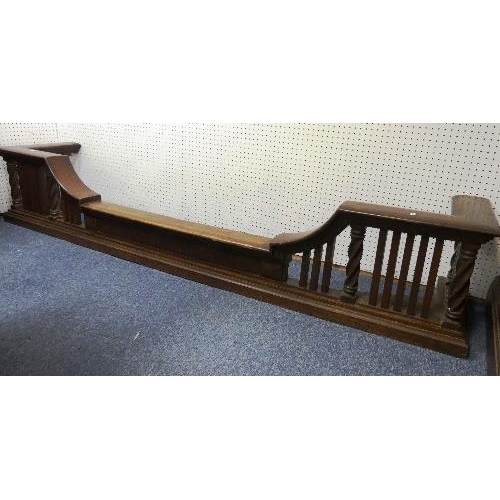 479 - An early 20th century oak Fire Fender, of large size, the shaped fender with plain square spindles a... 