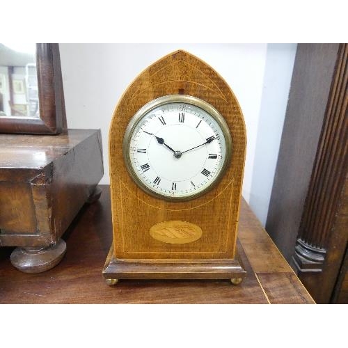 487 - An Edwardian inlaid mahogany Mantel Clock, with pointed arched top and shell cartouche raised on bun... 