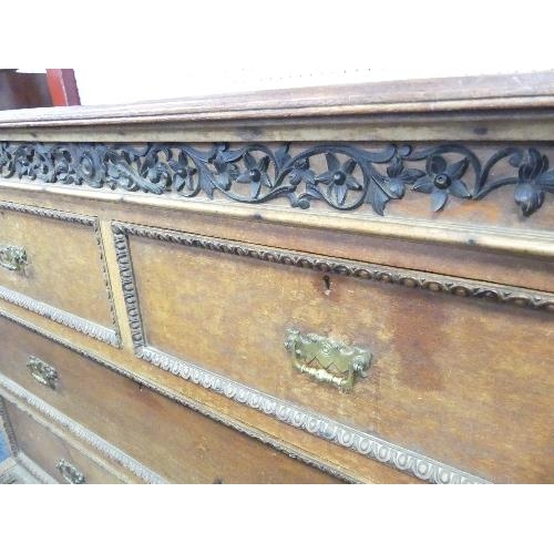 490 - A Continental antique carved oak Chest of Drawers, with two short drawers above two long, brass hand... 