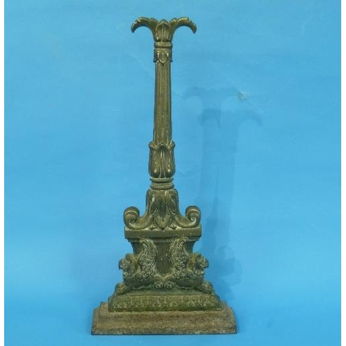 494 - A 19thC brass Doorstop, with two winged mythical beasts beneath a fluted column, 17in (43cm) high.