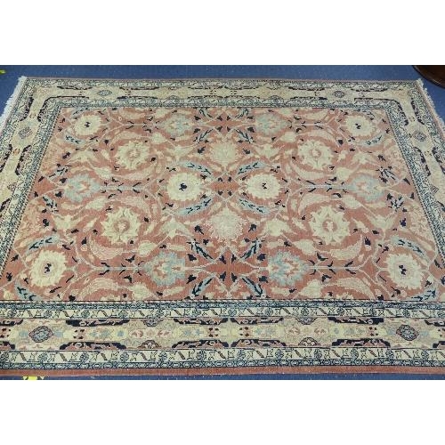 495 - Tribal Rugs; a large hand knotted Bakshaish style rug, the light coral-coloured ground with large st... 