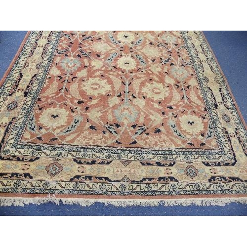 495 - Tribal Rugs; a large hand knotted Bakshaish style rug, the light coral-coloured ground with large st... 