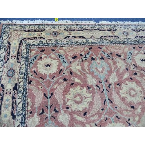 495 - Tribal Rugs; a large hand knotted Bakshaish style rug, the light coral-coloured ground with large st... 