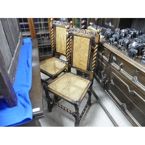 64 - A set of four Carolean-style oak Dining Chairs, with woven backs and barley twist supports, height 4... 