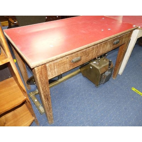 93 - An early 20thC oak Kitchen Table, with two frieze drawers and red melamine top, width 48in x depth 2... 