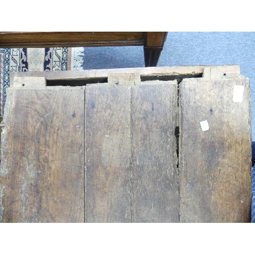 509 - An antique provincial Chest, the hinged four-plank with cleated ends, on stile supports, in distress... 