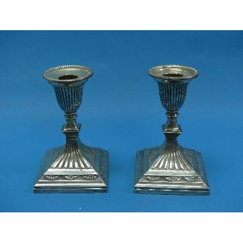 57 - A pair of Victorian silver short Candlesticks, by Hawksworth, Eyre & Co., hallmarked Sheffield, 1882... 