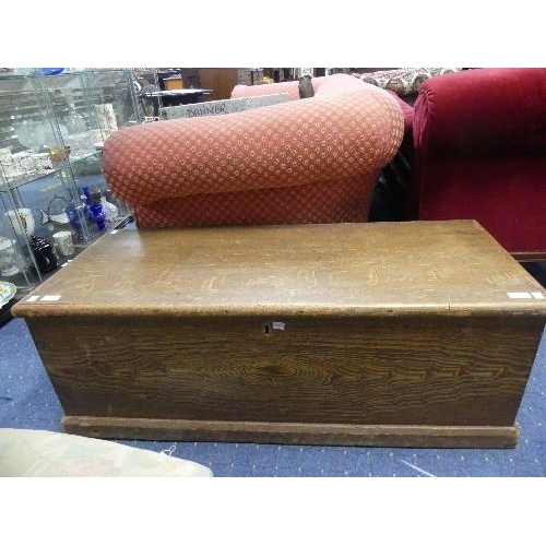 103 - A wood grain effect pine Blanket Box, with two brass carry handles, 43¼in (110cm) long, 18in (4cm) d... 