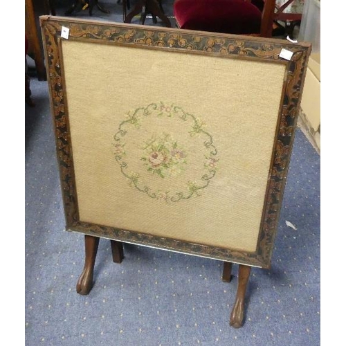 105 - An Edwardian mahogany Fire Screen/Tilt-top Table, an embroidered inset with floral decoration enclos... 