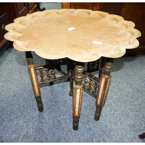 106 - An Anglo-Indian metamorphic Benares Table, the folding hardwood stand with mother of pearl decoratio... 