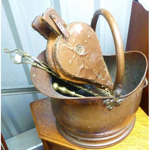 109 - A late 19thC/early 20thC copper Coal Scuttle, together with copper bellows, fire pokers, fire tongs,... 