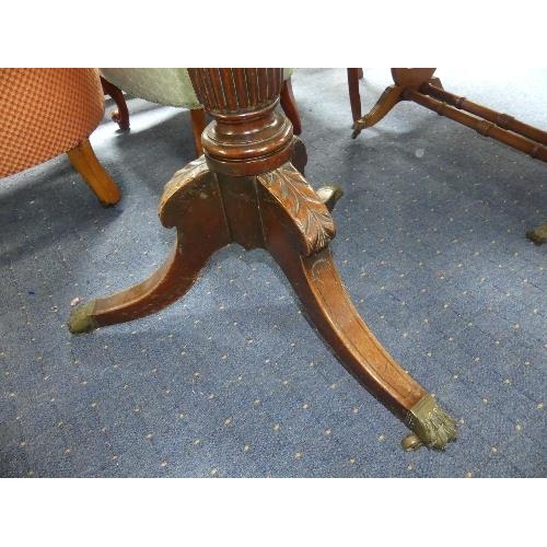 121 - A reproduction mahogany rectangular tilt-top Breakfast Table, with turned and fluted column, leaf ca... 