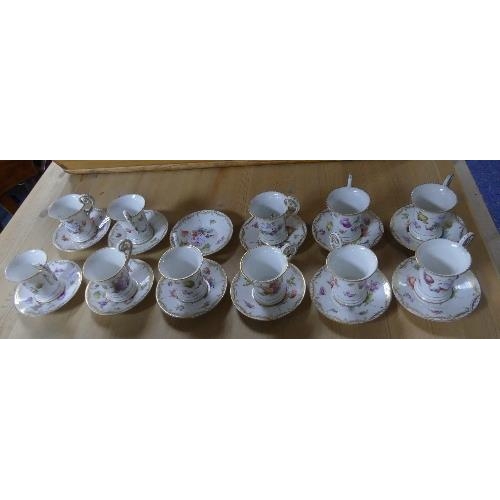 124 - An early 20thC near set of Dresden Coffee Cans and Saucers, comprising eleven Coffee Cans and twelve... 