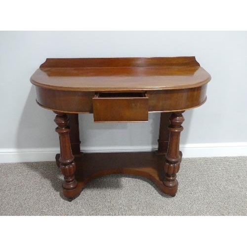 34 - A Victorian mahogany demi-lune Dressing Table, with single frieze drawer and fluted column supports,... 