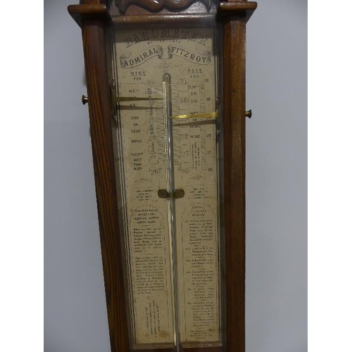 44 - A Victorian 'Admiral Fitzroy' Barometer, in carved oak case, 9in (23cm) wide, 46½in (118cm) high.