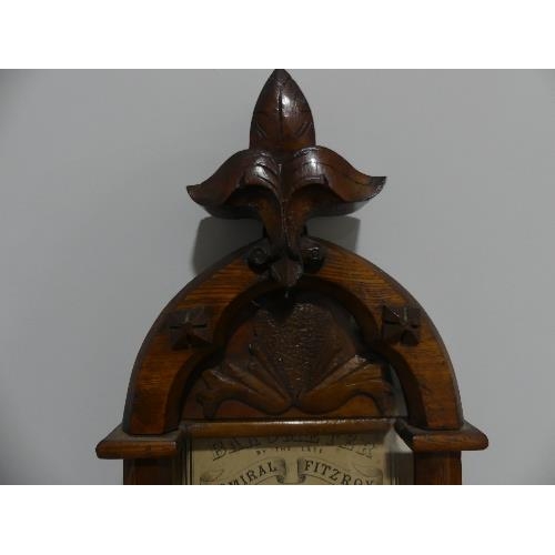 44 - A Victorian 'Admiral Fitzroy' Barometer, in carved oak case, 9in (23cm) wide, 46½in (118cm) high.