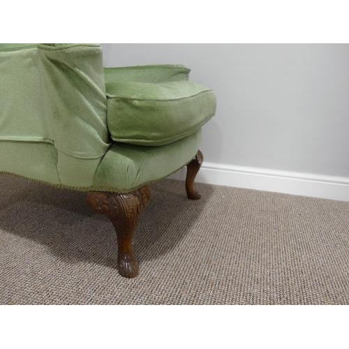 47 - An early 20thC Wing Armchair, in green upholstery, with carved cabriole front supports, 30½in (78cm ... 