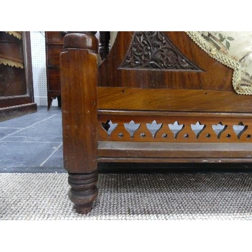 69 - A Victorian mahogany framed Day Bed, with carved and pierced decoration, lacks castors, 72in (183cm)... 