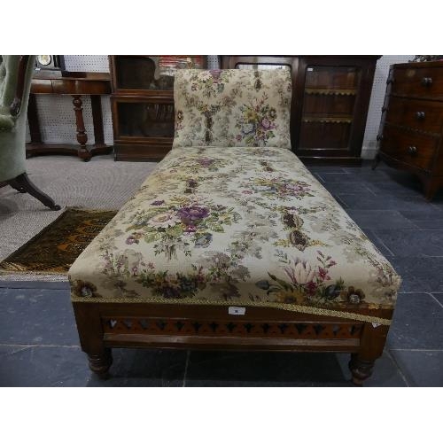 69 - A Victorian mahogany framed Day Bed, with carved and pierced decoration, lacks castors, 72in (183cm)... 