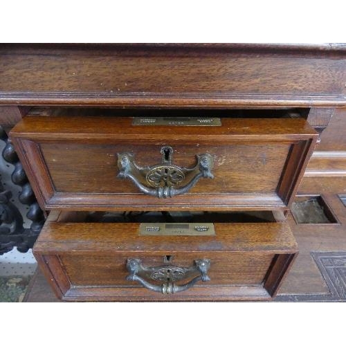 71 - An Edwardian walnut twin Pedestal Desk, by Maple & Co. Ltd., with raised back and tooled leather ski... 