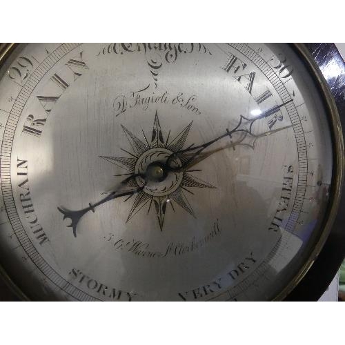 72 - A Victorian rosewood wheel Barometer, the silvered dial signed D. Fugioli & Son, 3 Gt. Warner Street... 