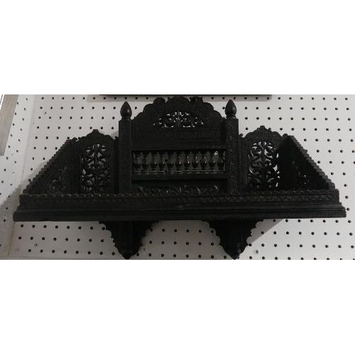 77 - A late 19th century Anglo-Indian carved ebonised Wall Bracket, some losses, 18in (45.75cm) wide x 13... 