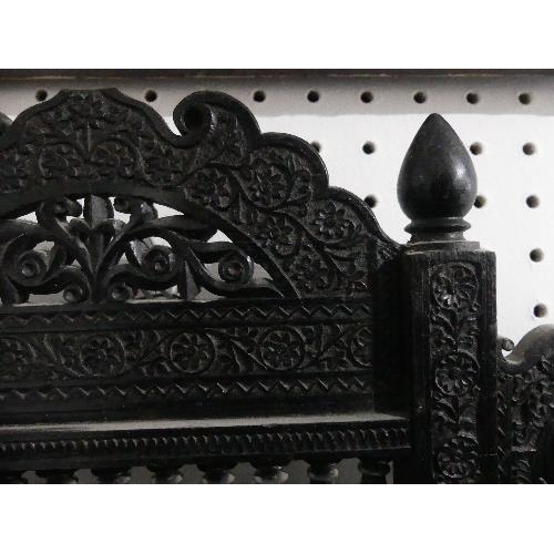 77 - A late 19th century Anglo-Indian carved ebonised Wall Bracket, some losses, 18in (45.75cm) wide x 13... 