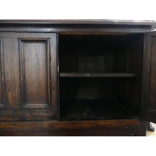 78 - A 19th century oak Carolean style Panelled Chest, with two cupboard doors above two long drawers on ... 