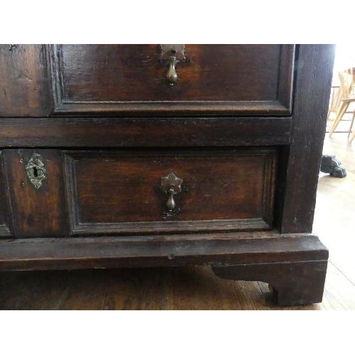 78 - A 19th century oak Carolean style Panelled Chest, with two cupboard doors above two long drawers on ... 