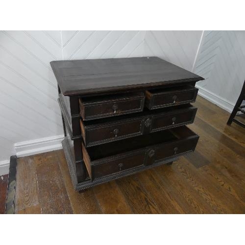 80 - An 18th century oak Panelled Chest, of two short and three long drawers, on block feet, 37½in (95cm)... 