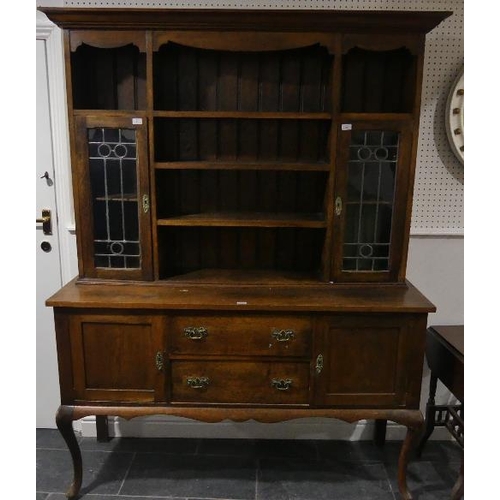 81 - An early 20th century Oak Dresser, with leaded glass panel doors, 60in (152.5cm) wide x 79in (200.5c... 