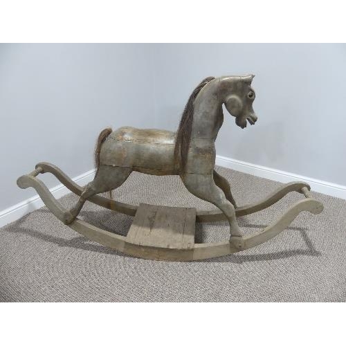 94 - A vintage carved wooden Rocking Horse on bow rockers, with real horse hair mane and tail ,forelock a... 