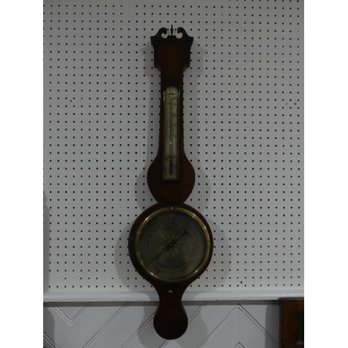 98 - An early 19thC mahogany wheel Barometer, signed P Nolfi, Taunton with a circular silvered dial, the ... 