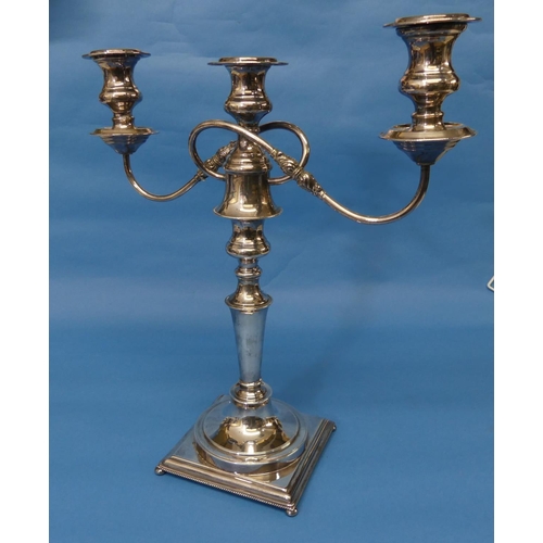 110 - A silver plated three light Candelabra, the scroll arms detachable to leave a single central light, ... 