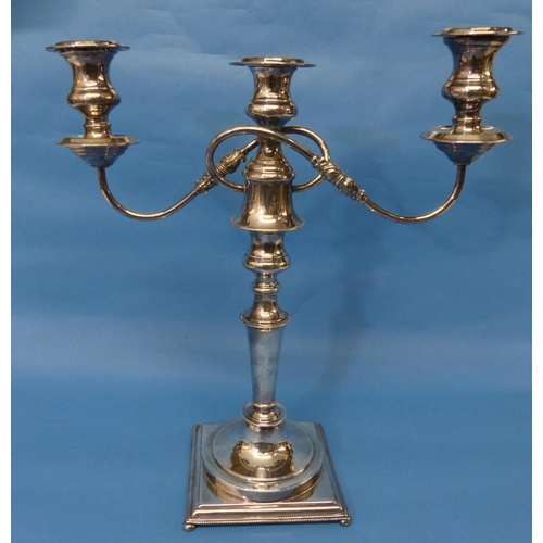 110 - A silver plated three light Candelabra, the scroll arms detachable to leave a single central light, ... 