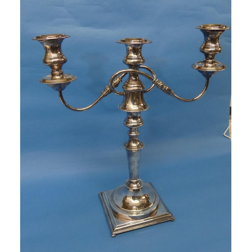 110 - A silver plated three light Candelabra, the scroll arms detachable to leave a single central light, ... 